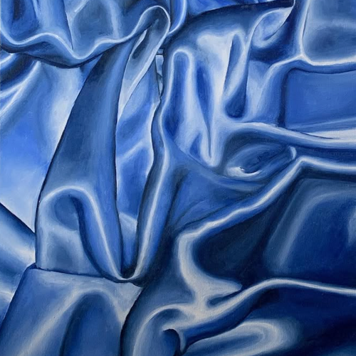 Blue satin fabric with folds and reflections